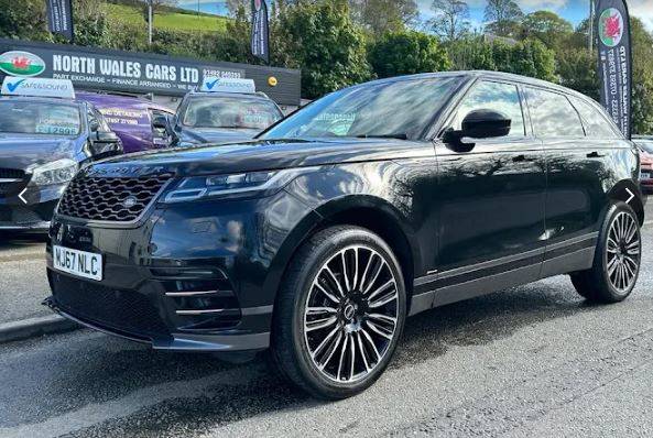Mechanic inspecting car